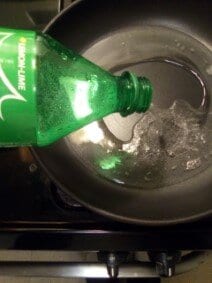 Pouring Sprite Into Pan before boiling 2