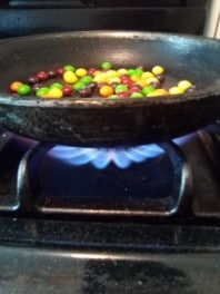 Skittles cooking in pan